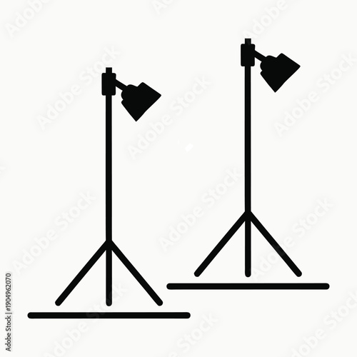 Black Line Art Icon of a Studio Spotlight on a Tripod Stand on White Background Keywords: spotlight, studio light, lighting, equipment