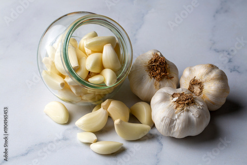Garlic cloves in a glass bo...