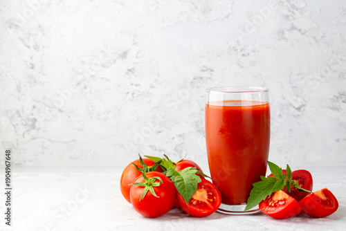 Tomato juice in a glass and...