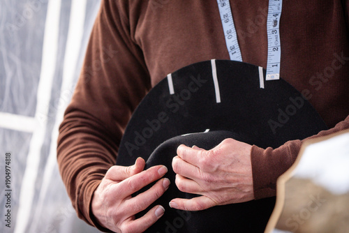 Photography western felt hat being handmade by shaping the felt