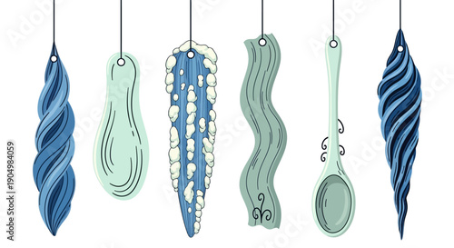 Various abstract decorative ornaments hanging from strings, showcasing diverse shapes and patterns in blue and green hues.