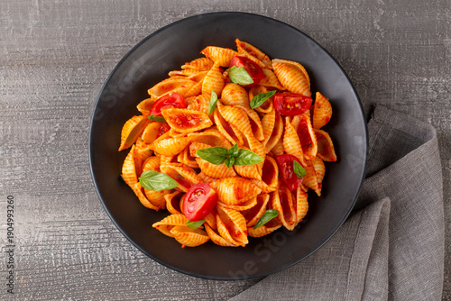 Italian shell pasta with to...