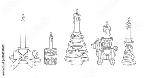 A set of decorative candle holders and cakes displayed on a plain surface, viewed from the front.
