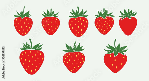 A collection of eight strawberries arranged in a grid pattern on a plain surface viewed from directly above