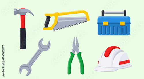 Collection of various construction tools and equipment on light green background