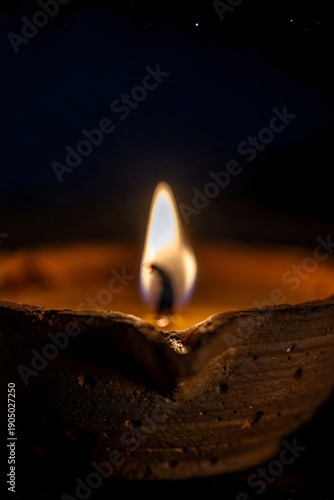 Macro Diya Flame Glowing in Dark Background