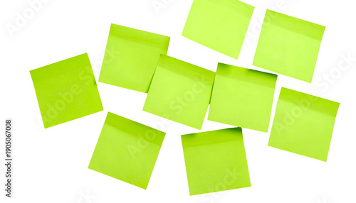 Overhead shot of neon green sticky notes scattered against a black background