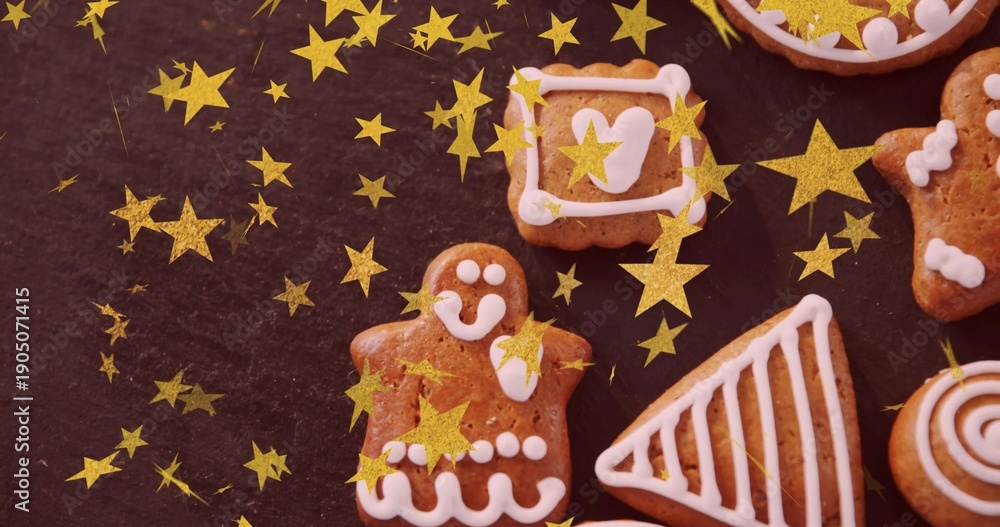 Fototapeta premium Featuring gingerbread person cookie iced with white on dark slate, amid cookies and gold stars