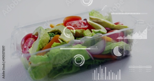 Showing clear clamshell salad with romaine, avocado, tomato on white table, with HUD overlays