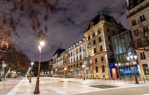 Fotografi Place Louis Lepine square features historic lamp posts and the illuminated facad
