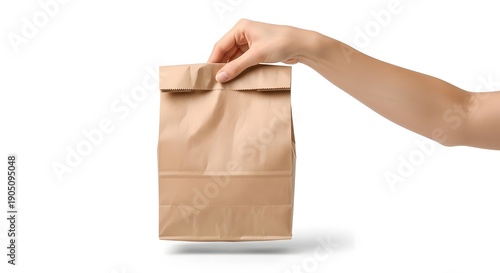 Female Hand Holding a Crumpled Brown Paper Bag, Isolated on a White Background, Eco-Friendly Takeaway Packaging