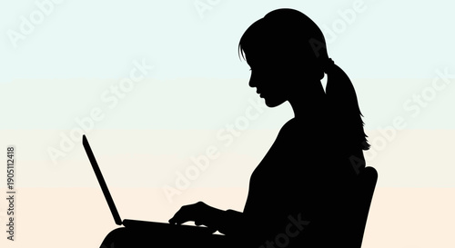 Woman working on laptop in a serene environment from a side view