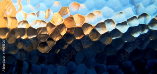 Abstract frosted glass with techno futurism light refraction. Modern honeycomb geometric pattern and blue gold bokeh distortion, ideal for futuristic technology and web backgrounds