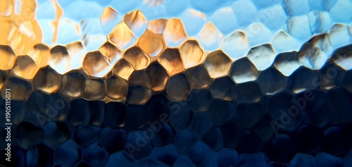Abstract frosted glass with techno futurism light refraction. Modern honeycomb geometric pattern and blue gold bokeh distortion, ideal for futuristic technology and web backgrounds