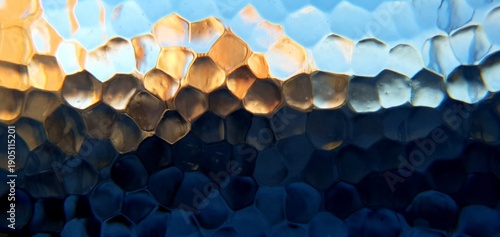 Abstract frosted glass with techno futurism light refraction. Modern honeycomb geometric pattern and blue gold bokeh distortion