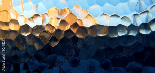 Abstract frosted glass with techno futurism light refraction. Modern honeycomb geometric pattern and blue gold bokeh distortion