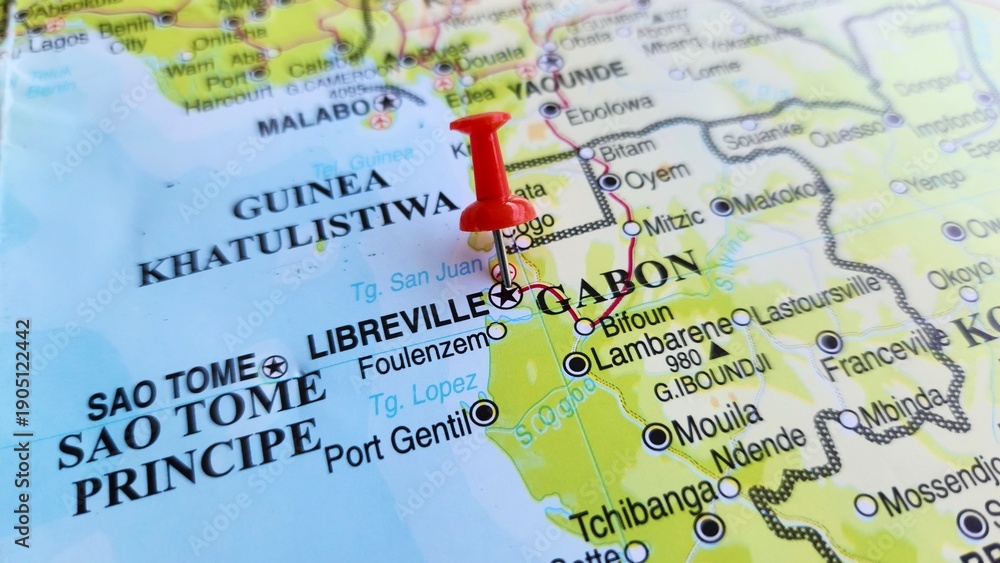 Naklejka premium View of Libreville, is the capital and largest city of Gabon, on a geographical map of Africa, marked with a red push pin.