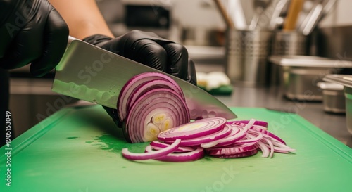 Culinary Precision: A culinary artist in black gloves slicing a vibrant red onion on a green cutting board, showcasing culinary skills and fresh ingredients.