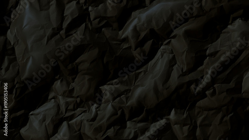 Crumpled paper texture in dark gray tones
