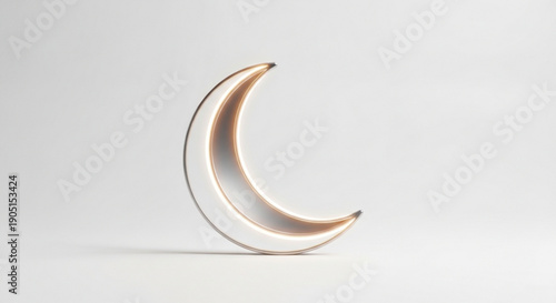 Golden crescent moon shaped decoration with soft lighting on white background