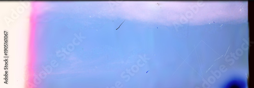 Authentic vintage 35mm film scan with aesthetic light leaks pink and blue color wash artistic film grain texture dusty scratches and analog cinematic retro overlay effect