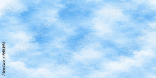 A beautiful clear blue summer sky filled with bright white fluffy cumulus clouds creating a natural sunny cloudscape across the atmosphere