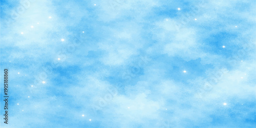 Beautiful abstract blue Christmas winter background featuring a sunny clear sky with fluffy white clouds and bright sunlight in a beautiful nature atmosphere