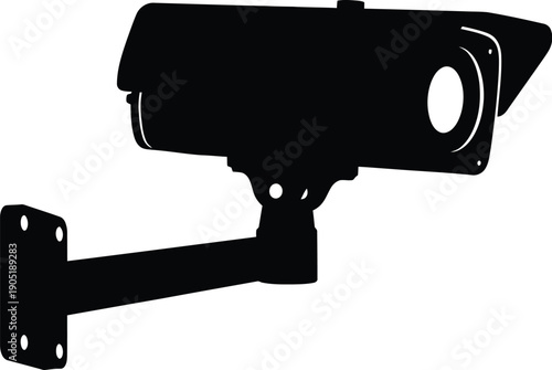 Surveillance camera mounted on wall capturing footage outside building with security lens