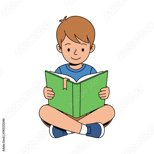 A happy young boy sitting cross legged reading a g