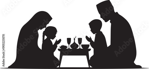 Family praying together at a table with religious silhouette