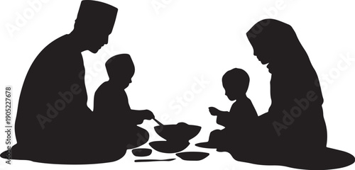 Family silhouette eating together on floor with bowls
