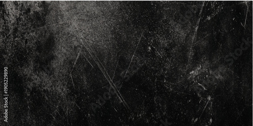 A dramatically dark and abstract image showcasing textured black surfaces with subtle white veining and light streaks