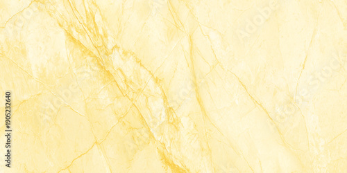 A close up view of a beautiful textured yellow marble surface with subtle veining patterns throughout