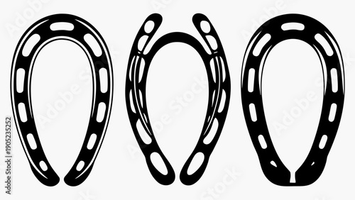 Three black horseshoes on white background for luck and decoration