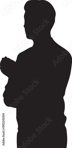 Silhouette of a person holding a small black white