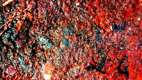 Quadro su tela Close-up of organic textured surface with red, brown, and dark hues showing deco