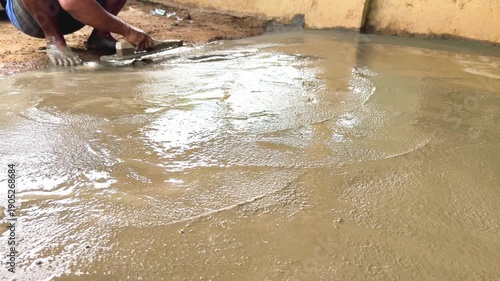 Manual Concrete Finishing at Small Construction Site