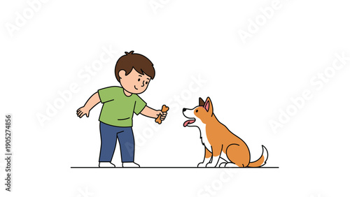 Young boy in a green shirt happily giving a bone as a treat to his loyal pet dog while standing against a clean white background.