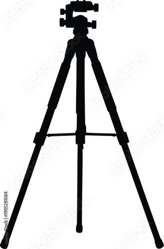Camera tripod standing tall with legs apart for stability and balance in photography