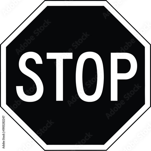 A black octagonal stop sign with white border and large white STOP text on it viewed directly