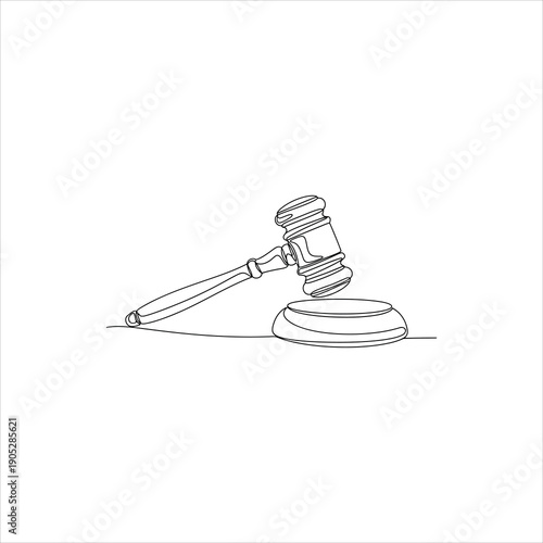 A gavel resting on a sound block