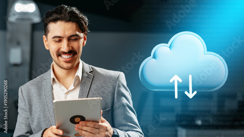 Man using tablet to manage data storage in cloud computing environment at modern office