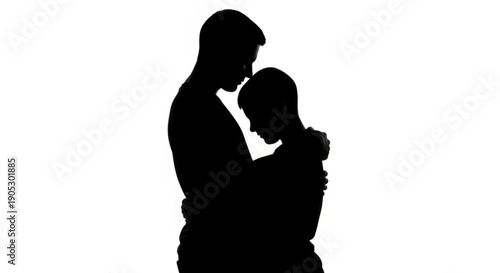 A tender moment between a man and child in a loving embrace from a side viewpoint