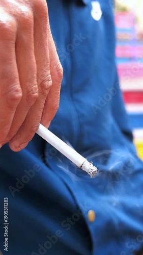 Person smoking a cigarette at a gathering