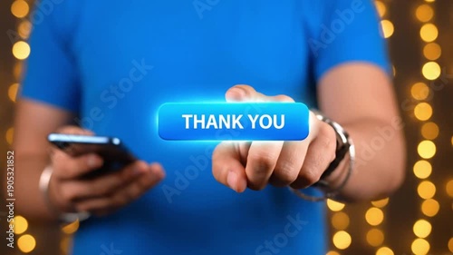 Man in blue shirt holding smartphone with blurred background lights
