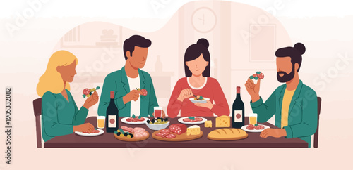 Four people enjoying a meal together at a table laden with food and wine