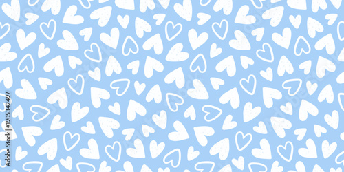 Seamless pattern of white hand drawn romantic hearts on a blue background. Design elements for Valentine's Day. Vector illustration