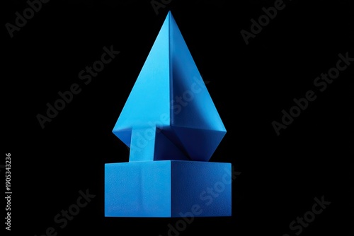 Bright blue geometric sculpture on a black background, with sharp angles