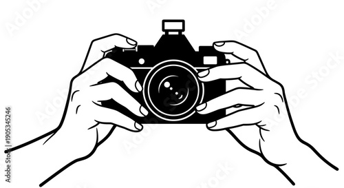 Hands holding vintage camera taking a photo.