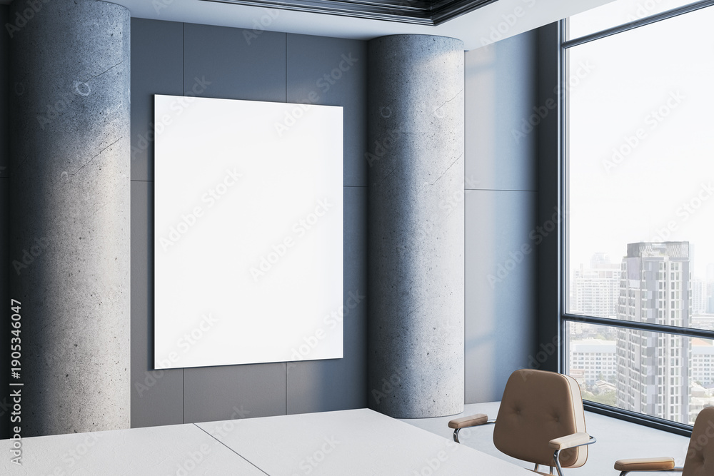 Fototapeta premium Vertical blank poster mockup displayed on modern gray wall between concrete columns in bright corporate office interior with city view windows. 3D Rendering